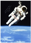 Bruce McCandless Signed 14'' x 19.25'' Photo of Him Performing the First Non-Tethered Spacewalk -- ''Reach for the Stars!''